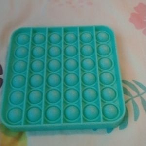 Teal glow in the dark pop it